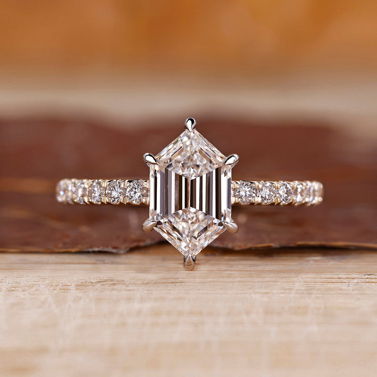 Pave diamond ring with hexagon step cut diamond centre.
