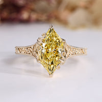 Dutch marquise diamond ring with yellow diamond.
