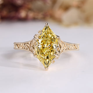 Dutch marquise diamond ring with yellow diamond.