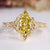 Dutch marquise diamond ring with yellow diamond.