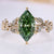 Dutch marquise diamond ring with green diamond.