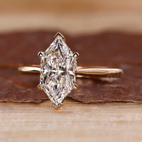 Lab grown marquise diamond ring hidden halo style.
