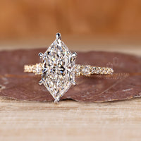 Dutch marquise ring pave round diamond hidden halo.
