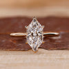 Dutch marquise diamond ring hidden halo v prong set.
