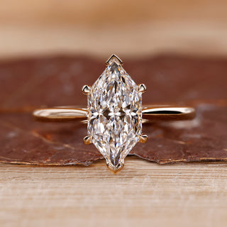 Dutch marquise diamond ring hidden halo v prong set.
