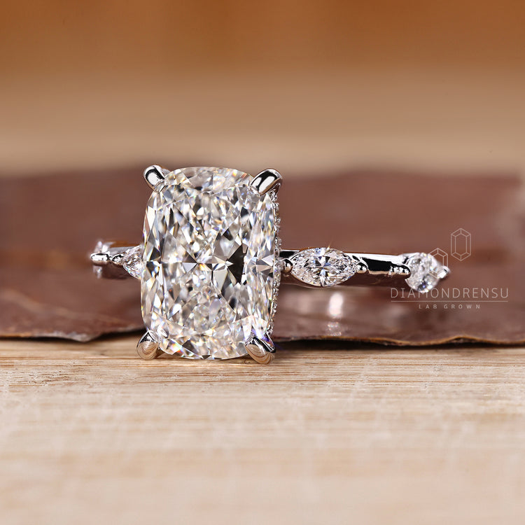 Hidden halo cushion diamond ring marquise pave style.
