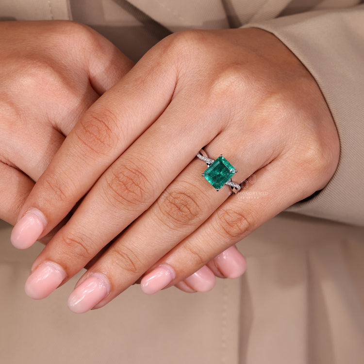 Round diamond pave emerald cut ring design.
