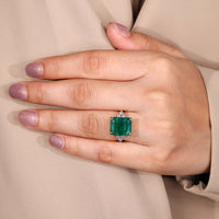 Emerald gemstone ring tapered shank muse style.
