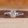 Emerald cut diamond ring pave band split shank prong set.
