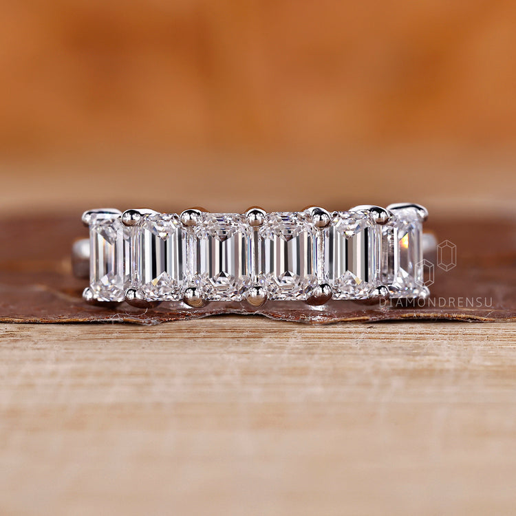 Six stone emerald cut diamond wedding band design.
