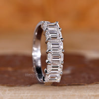 Lab grown emerald cut diamond wedding band six stone.
