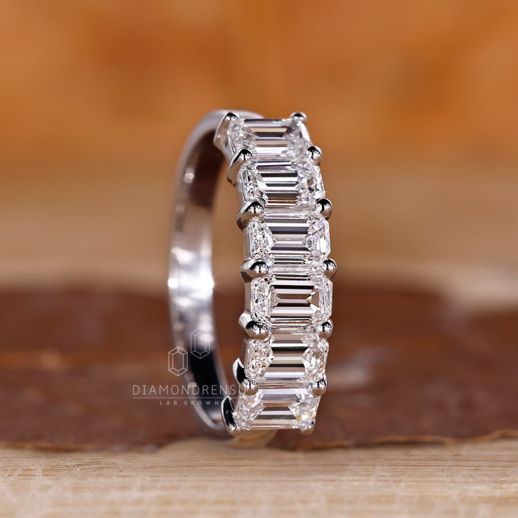 Lab grown emerald cut diamond wedding band six stone.
