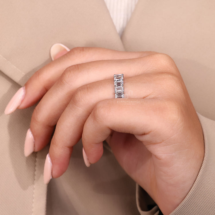 Emerald cut diamond band shared prong half eternity set.
