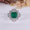 Asscher emerald ring marquise stones cluster twisted shank.
