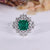 Asscher emerald ring marquise stones cluster twisted shank.

