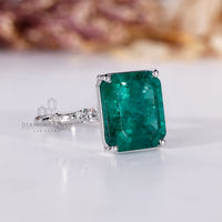 Emerald gemstone ring round marquise pave prong set.
