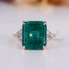 Emerald gemstone ring seven stone muse tapered shank.
