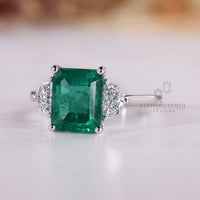 Handmade emerald cut ring half moon three stone design.
