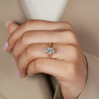 Handmade oval cut diamond ring with tulip basket.