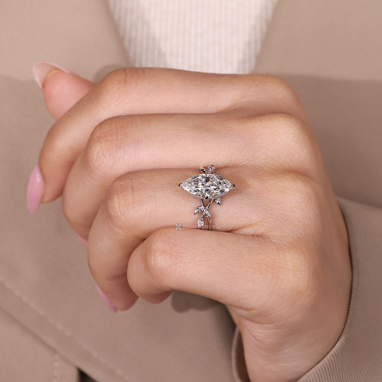 Marquise diamond ring compass prong setting.