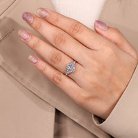 Cluster setting oval diamond ring with side stones.
