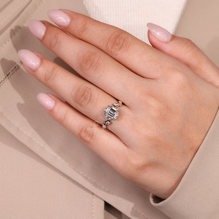 Cluster style emerald old European cut engagement ring.
