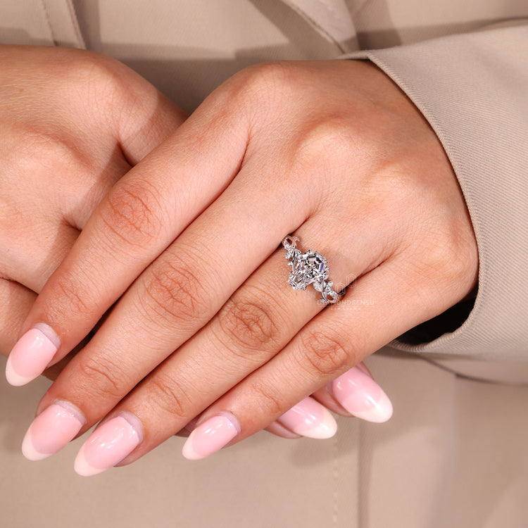 Coffin cut diamond ring with a cluster design, certified by IGI.