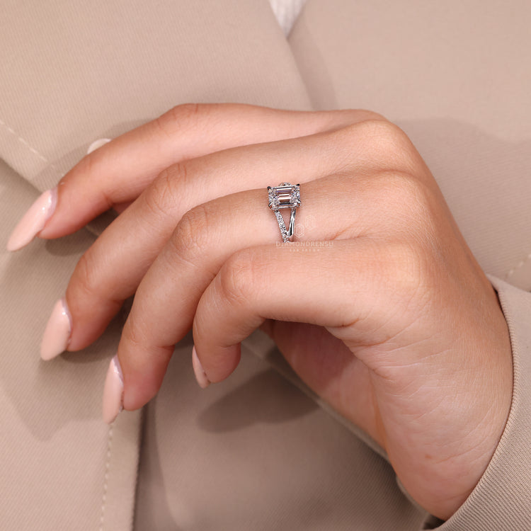 Handmade emerald cut diamond ring four claw prong set.
