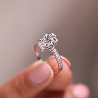Coffin cut ring pinch shank four heart prong setting.
