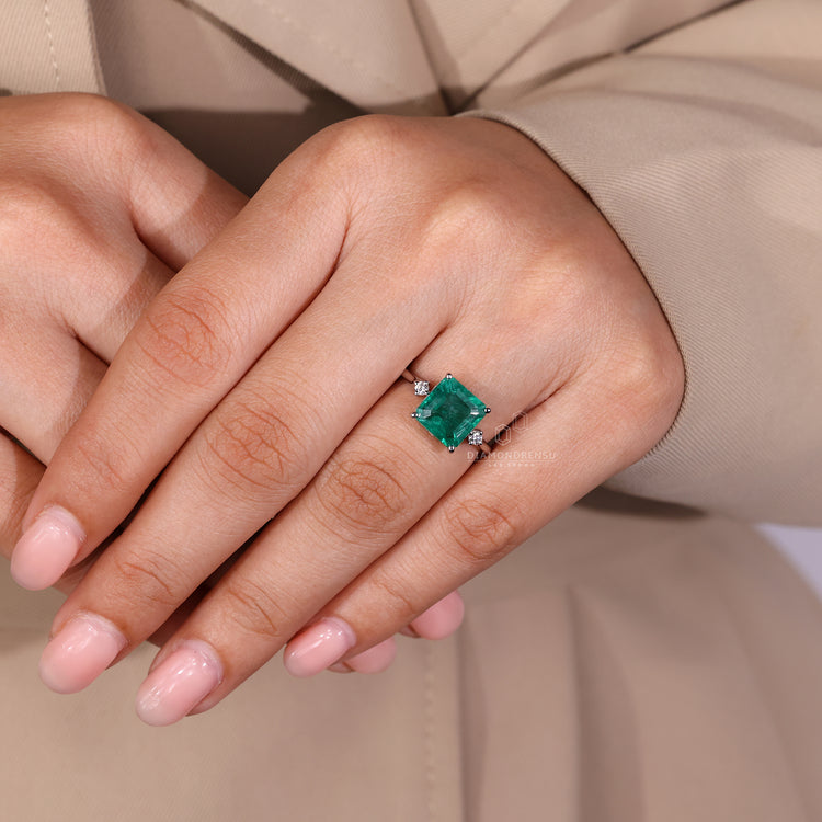 Asscher emerald ring tapered shank four prong set.
