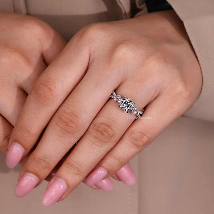 Cushion cut ring four prong setting.