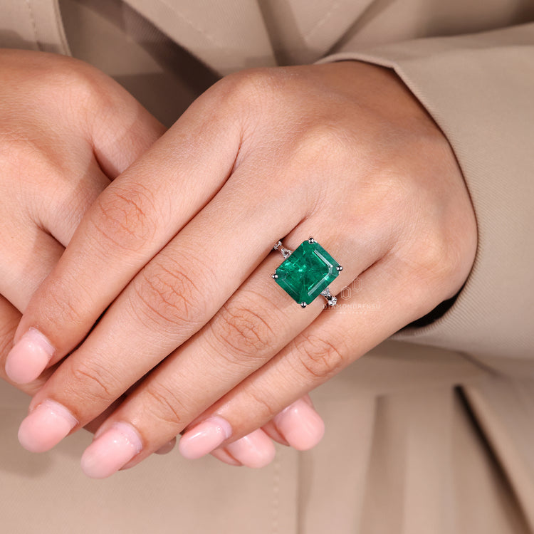 Emerald cut ring marquise round pave four prong set.
