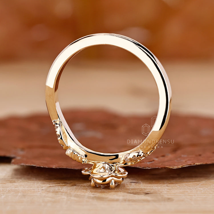 Round cut ring nature inspired twisted pave.