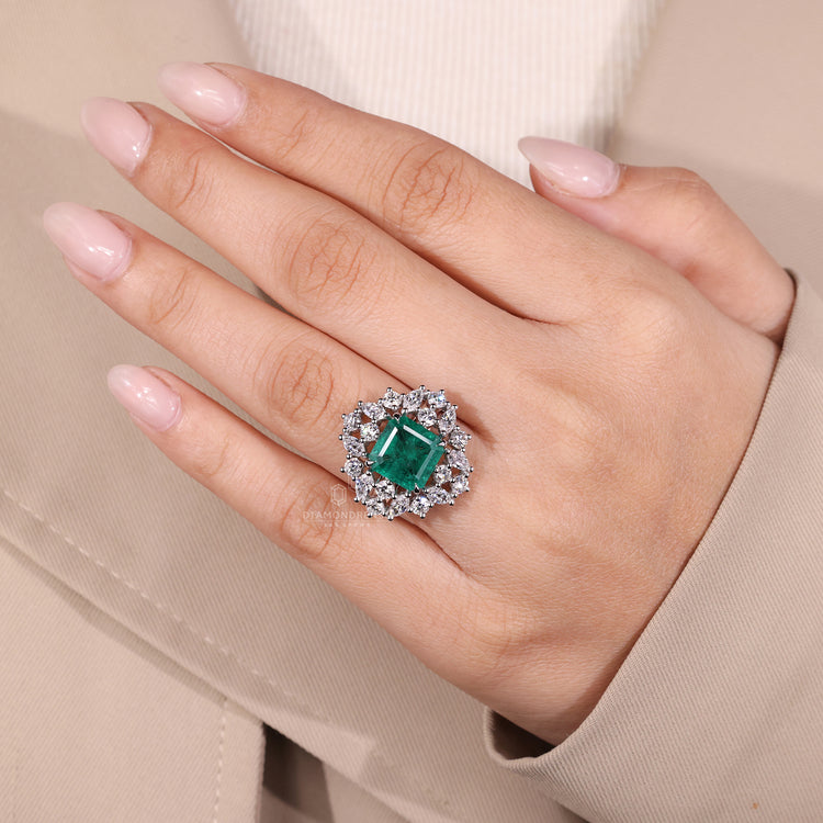 Nature inspired emerald ring marquise cluster setting.
