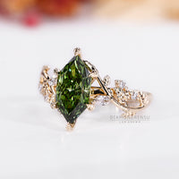 Lab grown marquise diamond ring green cluster style.