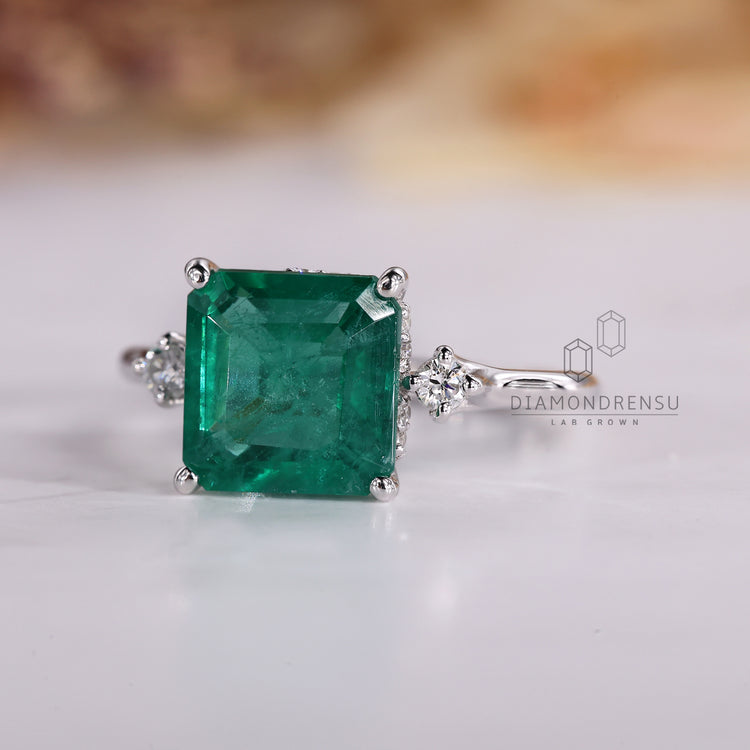 Handmade Asscher emerald ring tapered shank design.
