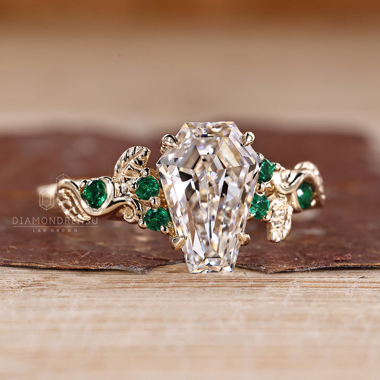 Nature inspired coffin diamond ring claw prong.