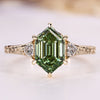 Hexagon diamond ring with trillion cut side stones.