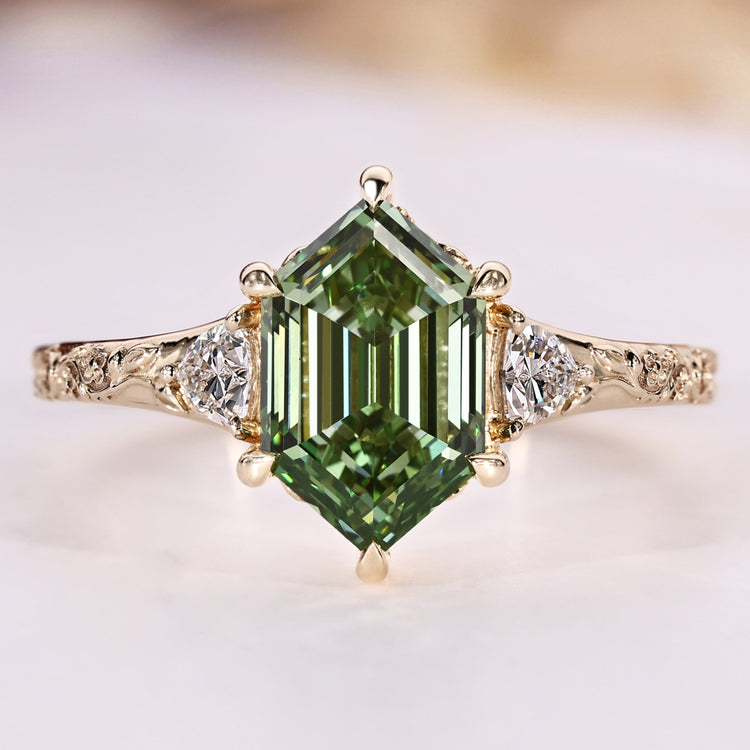 Hexagon diamond ring with trillion cut side stones.