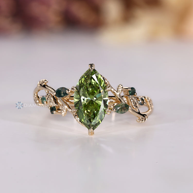 Green diamond ring with marquise and round moss agate.