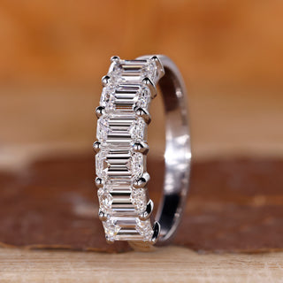 Emerald cut diamond wedding band six stone shared prong.
