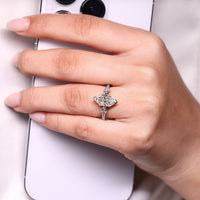 Lab grown Dutch marquise ring with pear side stones.
