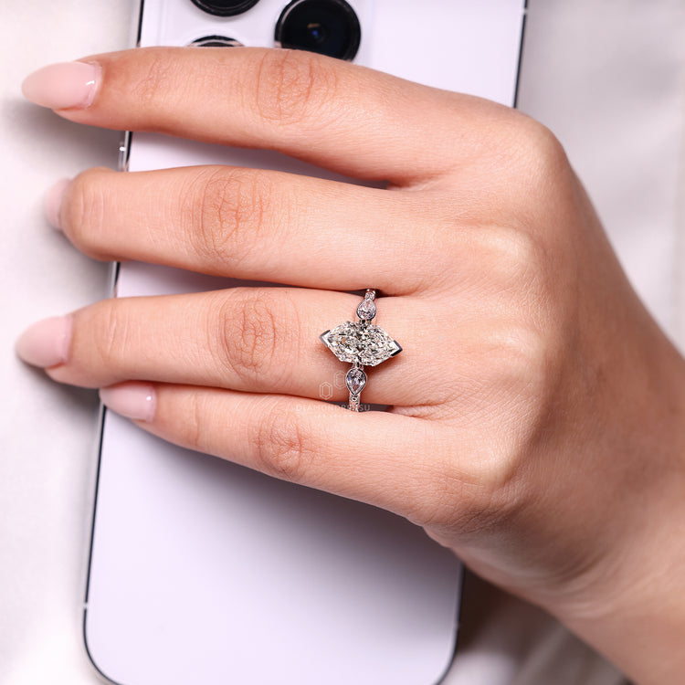 Lab grown Dutch marquise ring with pear side stones.
