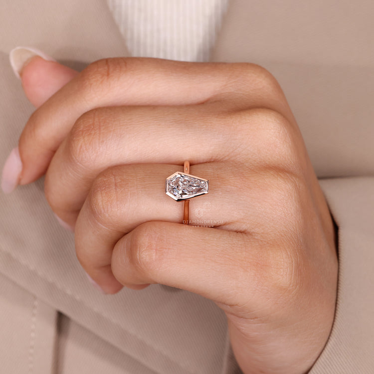 Coffin cut diamond ring IGI certified solitaire.