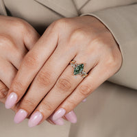 Lab grown marquise diamond ring with flower bud prongs.