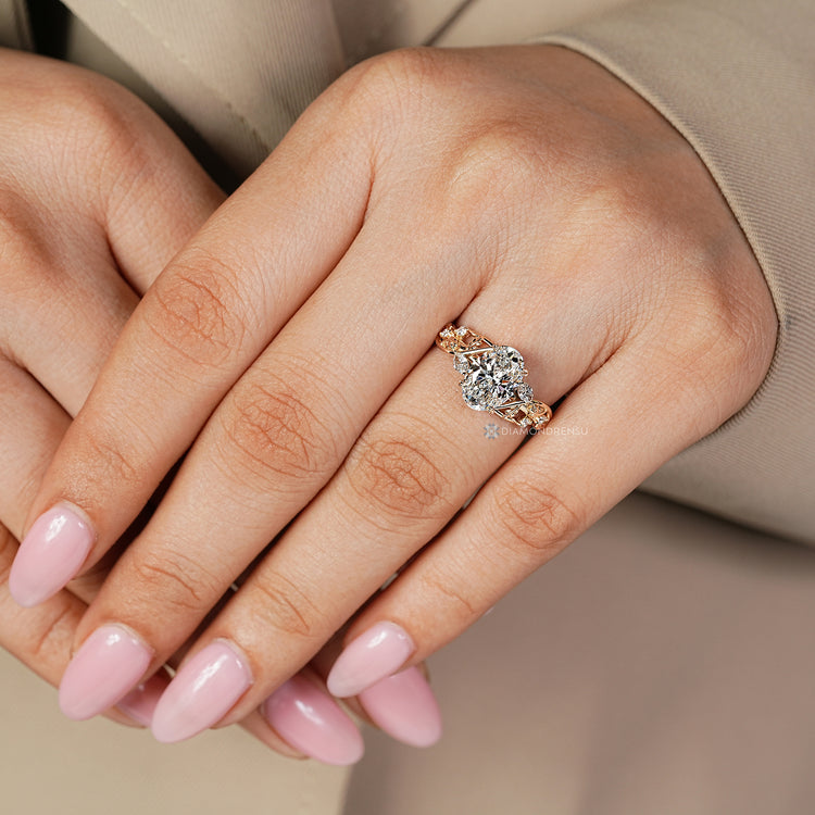 Oval diamond ring IGI certified leaf setting.