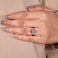 Lab grown diamond marquise ring with side stones.
