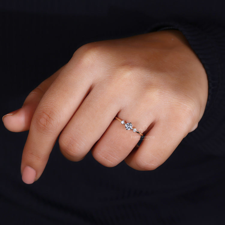 Round cut diamond ring modern three stone setting.