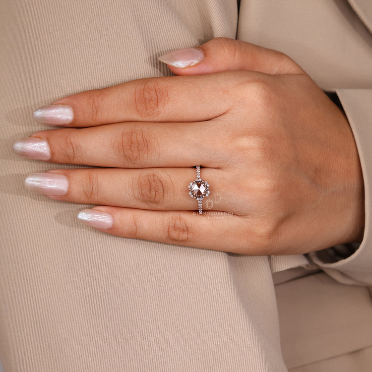Lab grown diamond round rose cut ring with halo detail.
