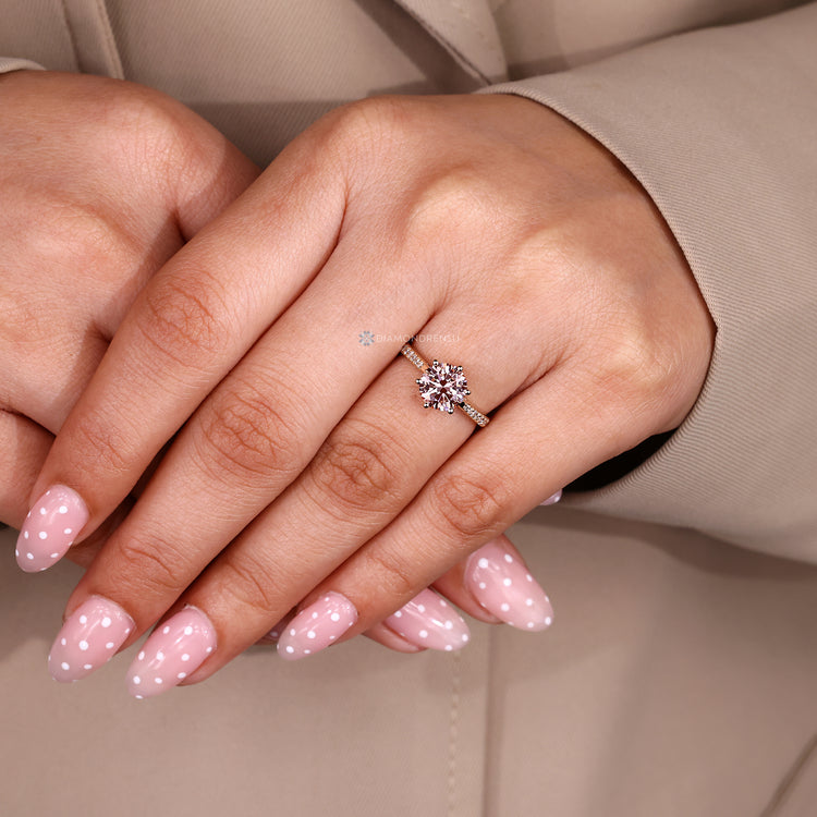 Handmade pink diamond ring with cathedral setting.